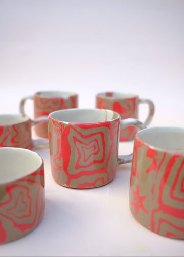 Set of Nerikomi Ceramic mugs with red and fawn abstract spirals pattern
